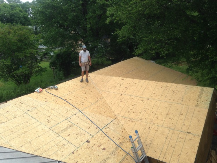 Plywood installed for new roof replacement by BNH Builders
