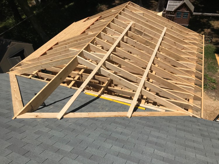Roof framing for a home by BNH Builders
