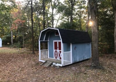 Shed with covered porch roof by BNH Builders